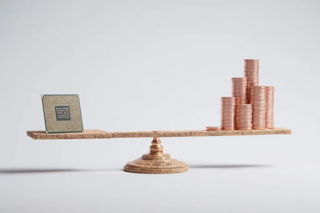 A CPU balancing with a small stack of money illustrating why Ryzen 5 is good for gaming