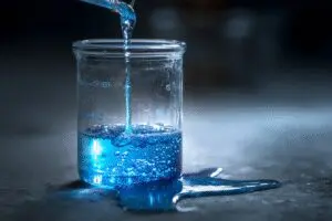 A leaking beaker of blue liquid a metaphor for what is a memory leak in gaming