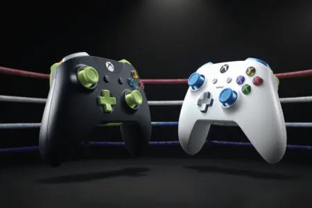 two rival gaming controllers facing off symbolizing the head-to-head battle for the best gaming console