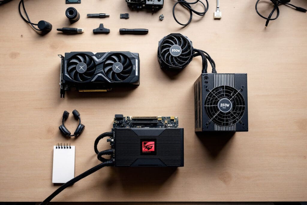 a high-end graphics card and cpu laid out next to a powerful 850w psu symbolizing the need to match power supply wattage to the pcs components